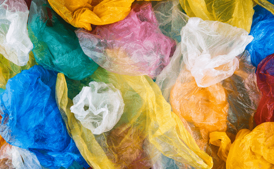 A series of colourful plastic bags spread across the image